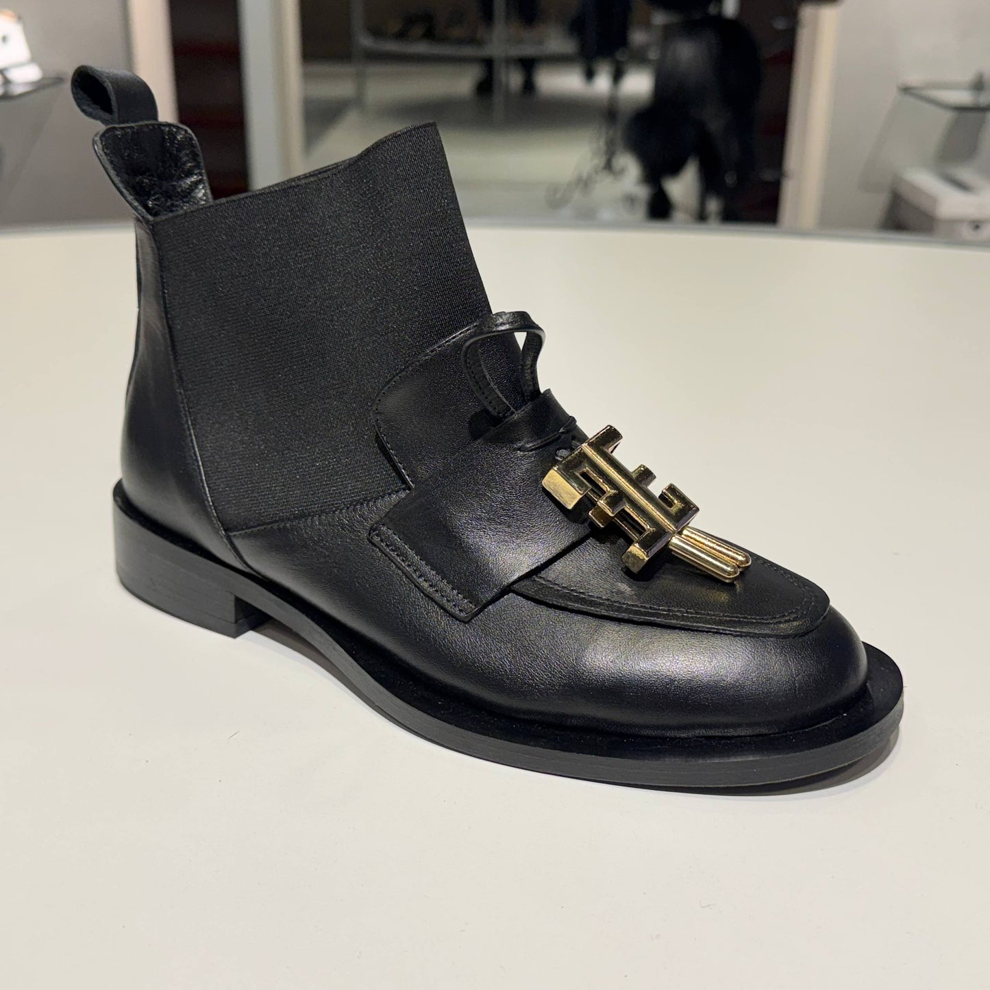 Black Leather Ankle Boot with Gold Hardware Detail